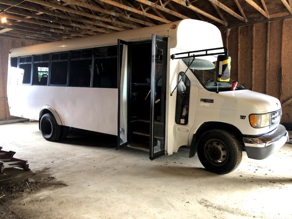 Our white shuttle bus on day one of the build.
